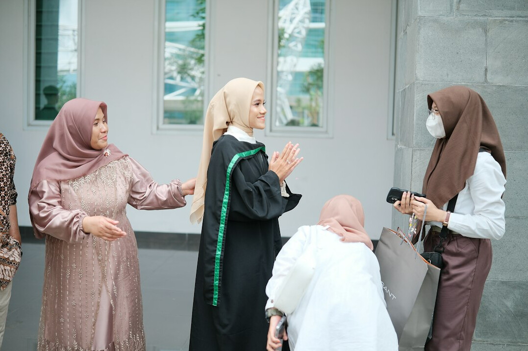 Diverse group of Malaysian coworkers in a meeting discussion